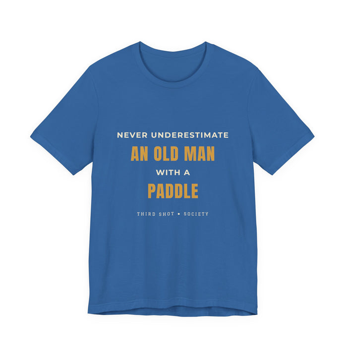 Columbia Blue unisex t-shirt with 'Never Underestimate an Old Man With a Paddle' pickleball slogan in gold and white – Third Shot Society | Color: Columbia Blue